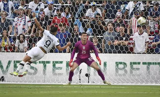 Guatemala forward Rubio Mendez (9) is unable to score past United States goalkeeper Matthew Freese (25) during the first half of a CONCACAF Gold Cup semifinal soccer match, Wednesday, July 2, 2025, in St. Louis. (AP Photo/Connor Hamilton)