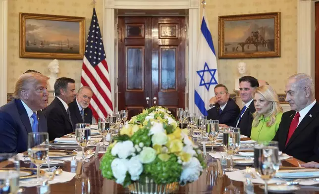President Donald Trump, left, meets with Israel's Prime Minister Benjamin Netanyahu, right, in the Blue Room of the White House, Monday, July 7, 2025, in Washington. (AP Photo/Alex Brandon)