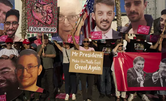 People attend a rally calling for the release of hostages held in the Gaza Strip and urges a ceasefire, in front of the U.S. Embassy branch office in Tel Aviv, Israel, Monday, July 7, 2025, ahead of the planned meeting between U.S. President Donald Trump and Israeli Prime Minister Benjamin Netanyahu. (AP Photo/Oded Balilty)