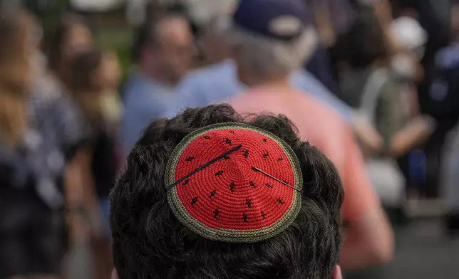 A demonstrator wears a watermelon kippah while protesting Israeli Prime Minister Benjamin Netanyahu's visit to Washington, Monday, July 7, 2025, near the White House. (AP Photo/Julia Demaree Nikhinson)