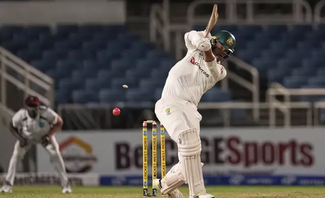 Australia's Mitchell Starc is bowled by West Indies' Jayden Seales on day one of the third Test cricket match at Sabina Park in Kingston, Jamaica, Saturday, July 12, 2025. (AP Photo/Ricardo Mazalan)