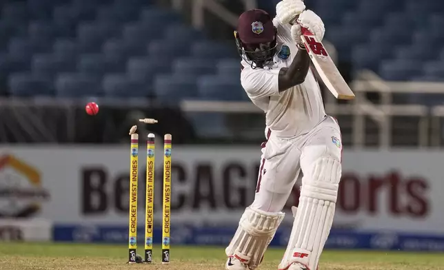 West Indies' Kevlon Anderson is bowled by Australia's Mitchell Starc on day one of the third Test cricket match at Sabina Park in Kingston, Jamaica, Saturday, July 12, 2025. (AP Photo/Ricardo Mazalan)