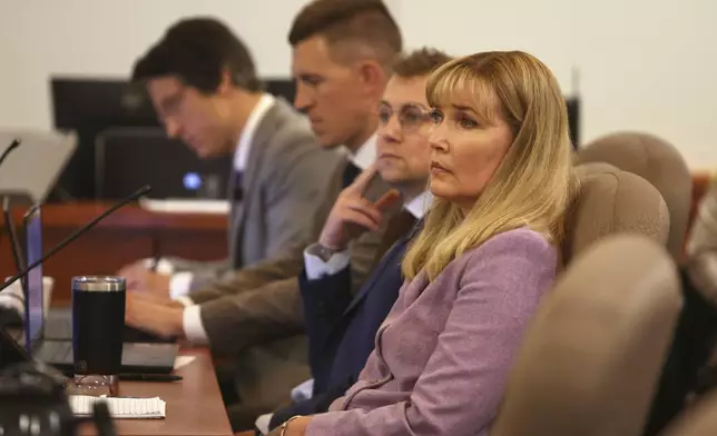 Minnesota state Sen. Nicole Mitchell, D-Woodbury, listens to the state's closing arguments during the fifth day of her felony burglary trial on Friday, July 18, 2025, at Becker County District Court in Detroit Lakes. To the right of Sen. Mitchell are her attorneys Matthew Keller, Dane DeKrey and Bruce Ringstrom Jr. (Anna Paige/The Forum via AP, Pool)