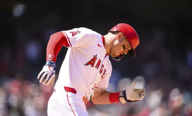 Los Angeles Angels' Mike Trout runs after hitting a home run during the fifth inning of a baseball game against the Seattle Mariners, Sunday, July 27, 2025, in Anaheim, Calif. (AP Photo/William Liang)