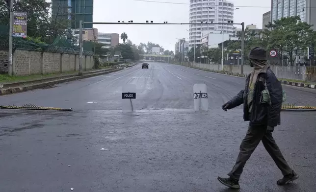 A road to the city center is barricadeed ahead of the historic 1990 Saba Saba, a Swahili word that means seven seven, protests for democratic reforms in Nairobi, Kenya Monday, July 7, 2025. (AP Photo/Brian Inganga)