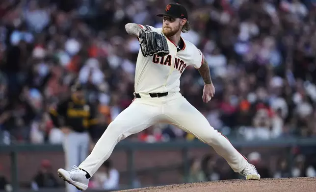 San Francisco Giants' Carson Whisenhunt pitches to a Pittsburgh Pirates batter during the fourth inning of a baseball game Monday, July 28, 2025, in San Francisco. (AP Photo/Godofredo A. Vásquez)