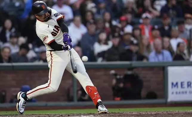 San Francisco Giants' Willy Adames hits an RBI single during the fourth inning of a baseball game against the Pittsburgh Pirates, Monday, July 28, 2025, in San Francisco. (AP Photo/Godofredo A. Vásquez)