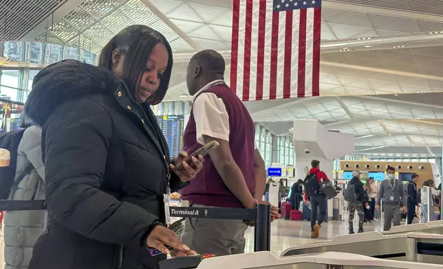FILE - Departing air travelers enter the TSA PreCheck screening lane at Newark Liberty International Airport in New Jersey, Dec. 19, 2024. (AP Photo/Ted Shaffrey, File)