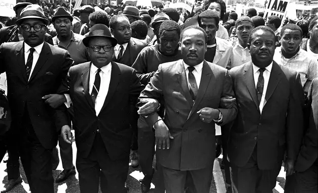 FILE - The Rev. Ralph Abernathy, right, and Bishop Julian Smith, left, flank Dr. Martin Luther King, Jr., during a civil rights march in Memphis, Tenn., March 28, 1968. (AP Photo/Jack Thornell, File)