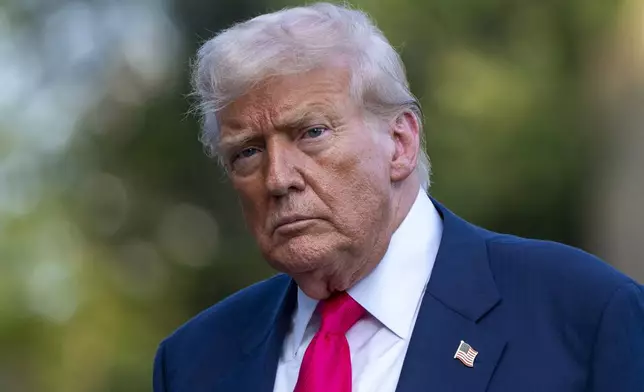 FILE - President Donald Trump walks from Marine One after arriving on the South Lawn of the White House, Tuesday, July 15, 2025, in Washington. (AP Photo/Alex Brandon, File)