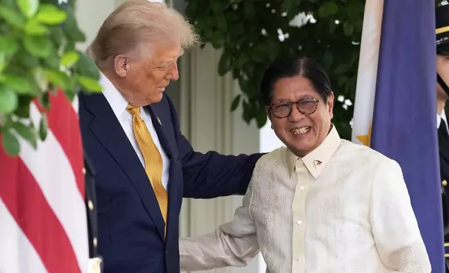 President Donald Trump greets Philippine President Ferdinand Marcos Jr., upon arrival at the White House, Tuesday, July 22, 2025, in Washington. (AP Photo/Alex Brandon)