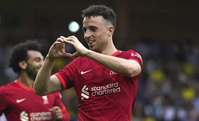 FILE - Liverpool's Diogo Jota celebrates scoring during the Premier League match at Carrow Road, Norwich, Saturday Aug. 14, 2021. (Joe Giddens/PA via AP, File)