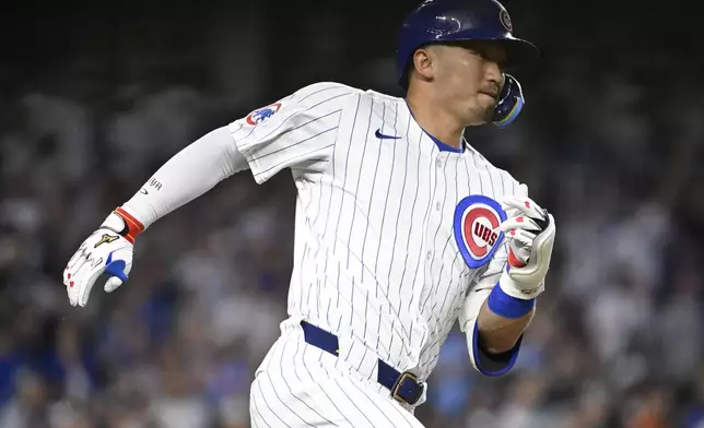 Chicago Cubs' Seiya Suzuki runs to first base after he hits a home run during the sixth inning of a baseball game against the Cleveland Guardians, Tuesday, July 1, 2025, in Chicago. (AP Photo/Matt Marton)