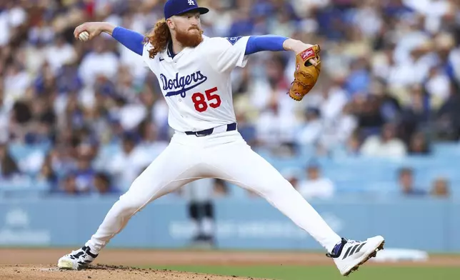 Los Angeles Dodgers pitcher Dustin May throws to a Chicago White Sox batter during the first inning of a baseball game, Thursday, July 3, 2025, in Los Angeles. (AP Photo/Jessie Alcheh)