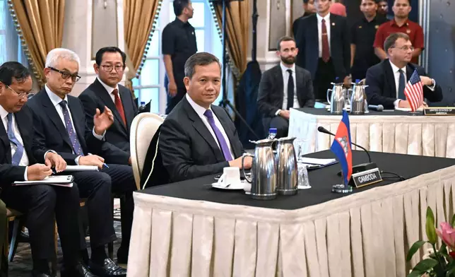 Cambodia's Prime Minister Hun Manet, center, looks on during talks with Thailand's acting Prime Minister Phumtham Wechayachai, mediated by Malaysia's Prime Minister Anwar Ibrahim, on a possible ceasefire between Thailand and Cambodia in Putrajaya Monday, July 28, 2025.(Mohd Rasfan/Pool Photo via AP)