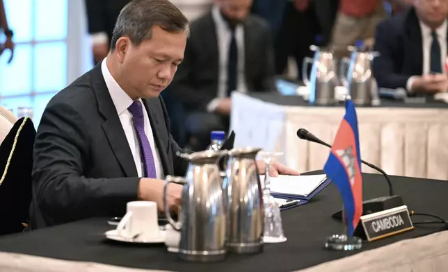 Cambodia's Prime Minister Hun Manet, center, looks on during talks with Thailand's acting Prime Minister Phumtham Wechayachai, mediated by Malaysia's Prime Minister Anwar Ibrahim, on a possible ceasefire between Thailand and Cambodia in Putrajaya Monday, July 28, 2025.(Mohd Rasfan/Pool Photo via AP)