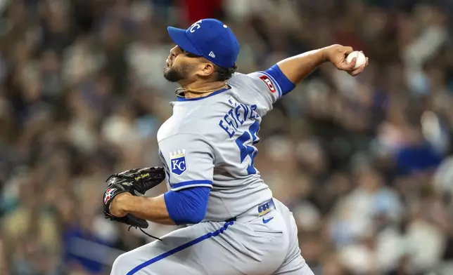 Kansas City Royals reliever Carlos Estevez delivers a pitch during the eighth inning of a baseball game against the Seattle Mariners, Thursday, July 3, 2025, in Seattle. (AP Photo/Stephen Brashear)