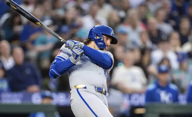 Kansas City Royals' Vinnie Pasquantino hits a two-run single during the seventh inning of a baseball game against the Seattle Mariners, Thursday, July 3, 2025, in Seattle. (AP Photo/Stephen Brashear)