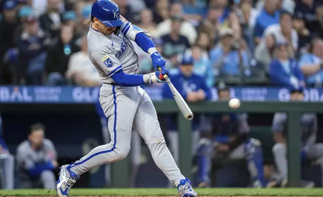 Kansas City Royals' Bobby Witt Jr. hits a RBI-single during the seventh inning of a baseball game against the Seattle Mariners, Thursday, July 3, 2025, in Seattle. (AP Photo/Stephen Brashear)