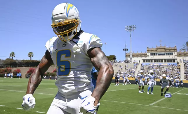 Los Angeles Chargers linebacker Denzel Perryman (6) flexes as he runs a drill during practice at the team's NFL football training camp, Wednesday, July 23, 2025, in San Diego. (AP Photo/Denis Poroy)