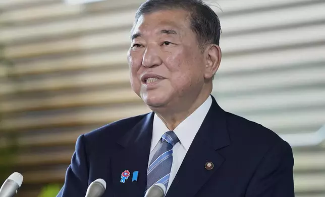 Japanese Prime Minister Shigeru Ishiba speaks to the media regarding the Japan-U.S. trade framework at the prime minister's office in Tokyo, Japan, Wednesday, July 23, 2025. (Kyodo News via AP)