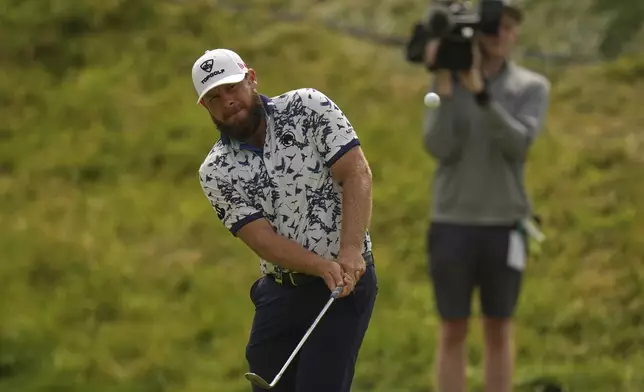 Tyrrell Hatton of England chips onto the 7th green during the second round of the British Open golf championship at the Royal Portrush Golf Club, Northern Ireland, Friday, July 18, 2025. (AP Photo/Francisco Seco)