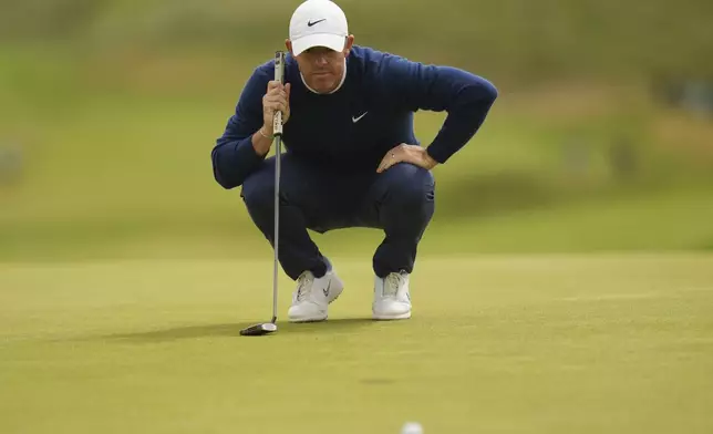 Rory McIlroy of Northern Ireland looks at his putt on the 7th green during the second round of the British Open golf championship at the Royal Portrush Golf Club, Northern Ireland, Friday, July 18, 2025. (AP Photo/Francisco Seco)