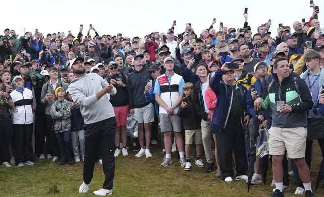 Scottie Scheffler of the United States plays out of the rough on the 17th hole during the second round of the British Open golf championship at the Royal Portrush Golf Club, Northern Ireland, Friday, July 18, 2025. (AP Photo/Jon Super)