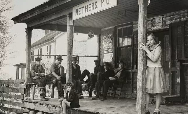 This photo provided by the Library of Congress shows people at the Nethers, Va., post office in Oct. 1935, during the Great Depression. (Arthur Rothstein/Farm Security Administration/Library of Congress via AP)