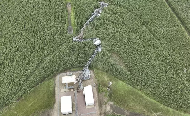 In this image provided by the Lincoln County, S.D., Sheriff's Office, a cell tower sustained damage following strong winds overnight in southern Lincoln County, South Dakota, Tuesday, July 29, 2025. (Sgt. E.J. Colshan/Lincoln County Sheriff's Office via AP)