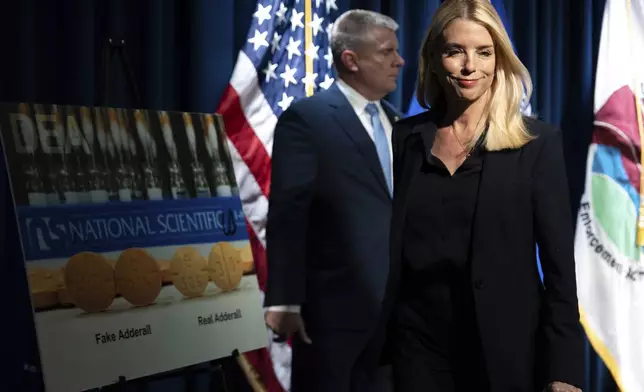 Attorney General Pam Bondi leaves following a news conference at the Drug Enforcement Administration, Tuesday, July 15, 2025, in Arlington, Va. (AP Photo/Julia Demaree Nikhinson)