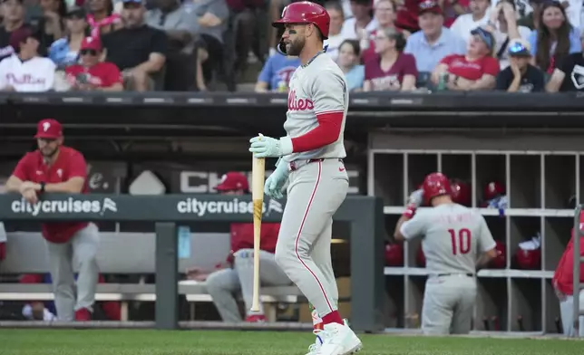 Philadelphia Phillies' Bryce Harper looks to the field after striking out swinging during the first inning of a baseball game against the Chicago White Sox in Chicago, Monday, July 28, 2025. (AP Photo/Nam Y. Huh)