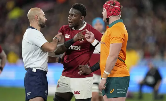 Referee Andrea Piardi speaks to Maro Itoje of the British &amp; Irish Lions and Australia's Harry Wilson, right, during the second rugby union test at the Melbourne Cricket Ground in Melbourne, Australia, Saturday, July 26, 2025. (AP Photo/Rick Rycroft)