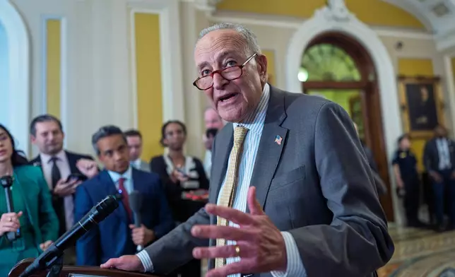 Senate Minority Leader Chuck Schumer, D-N.Y., speaks with reporters as the Senate holds its first procedural vote on Emil Bove's nomination for the 3rd Circuit Court of Appeals, at the Capitol in Washington, Tuesday, July 22, 2025. (AP Photo/J. Scott Applewhite)