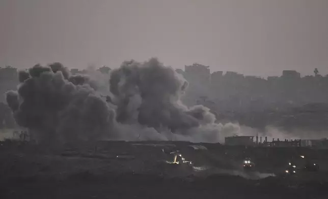 Smoke rises from Israeli bombardment of the Gaza Strip, seen from southern Israel, Thursday, July 3, 2025. (AP Photo/Leo Correa)