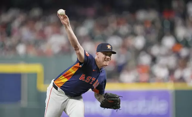 Houston Astros starting pitcher Hunter Brown throws against the Texas Rangers during the first inning of a baseball game Sunday, July 13, 2025, in Houston. (AP Photo/David J. Phillip)
