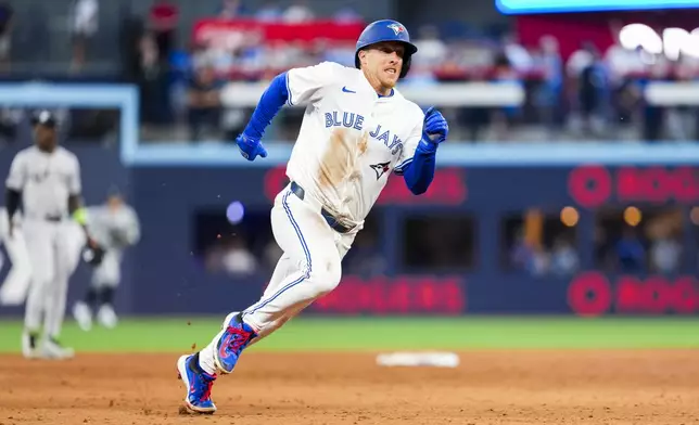 Toronto Blue Jays' Myles Straw rounds third base against the New York Yankees during fifth-inning baseball game action in Toronto, Monday, July 21, 2025. (Thomas Skrlj/The Canadian Press via AP)