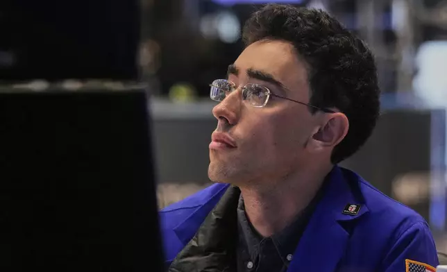 Specialist Alex Weitzman works at his post on the floor of the New York Stock Exchange, Monday, July 21, 2025. (AP Photo/Richard Drew)