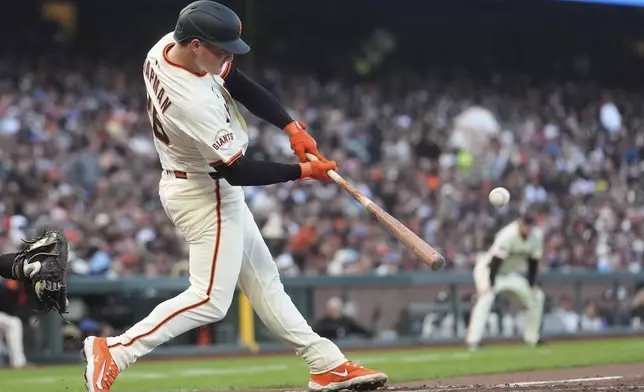 San Francisco Giants' Matt Chapman hits a ground-rule double against the Philadelphia Phillies during the third inning of a baseball game in San Francisco, Monday, July 7, 2025. (AP Photo/Jeff Chiu)
