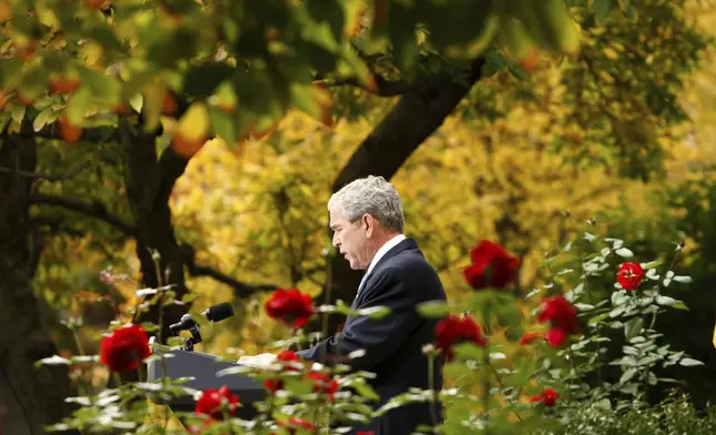 FILE - President George Bush makes a statement about the transition of the administration of President-elect Barack Obama, Nov. 5, 2008, in the Rose Garden of the White House in Washington. (AP Photo/Gerald Herbert, File)
