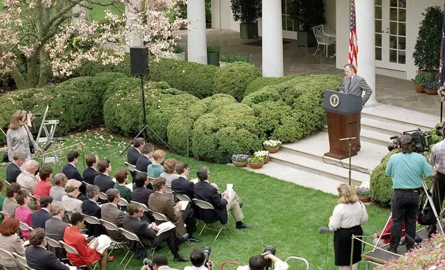 FILE - President George H. W. Bush holds an outdoor news conference in the Rose Garden of the White House in Washington, April 11, 1992. (AP Photo/Doug Mills, File)