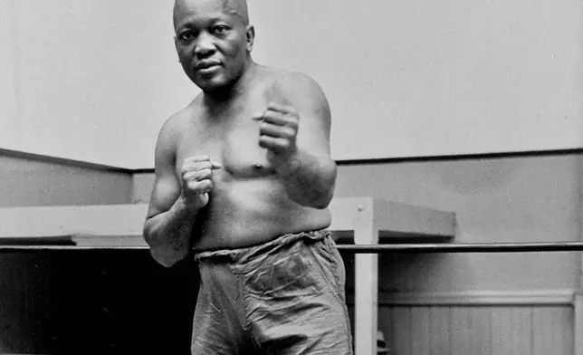 FILE - Boxer Jack Johnson, the first Black world heavyweight champion, poses in New York City, 1932. (AP Photo/File)
