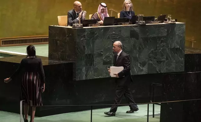 Palestinian Prime Minister Mohammed Mustafa walks off stage after speaking at a high-level International Conference for the Peaceful Settlement of the Question of Palestine and the Implementation of the Two-State solution at United Nations Headquarters, on Monday, July 28, 2025. (AP Photo/Adam Gray)