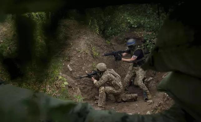 Ukrainian 3rd Assault Brigade recruits train at the polygon in Kyiv region, Ukraine, on Wednesday, July 16, 2025. (AP Photo/Evgeniy Maloletka)