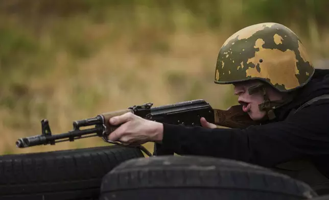 A Ukrainian 3rd Assault Brigade recruit trains at the polygon in Kyiv region, Ukraine, on Wednesday, July 16, 2025. (AP Photo/Evgeniy Maloletka)