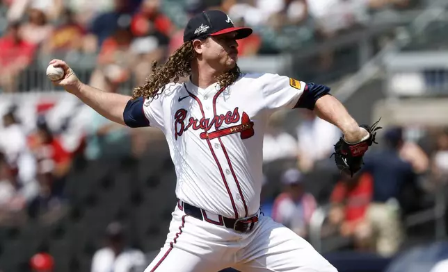 Atlanta Braves pitcher Grant Holmes throws during the first inning of a baseball game against the Baltimore Orioles, Sunday, July 6, 2025, in Atlanta. (AP Photo/Butch Dill)