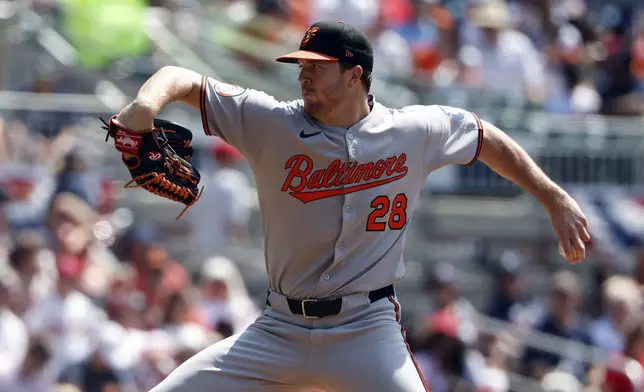 Baltimore Orioles pitcher Trevor Rogers throws during the first inning of a baseball game against the Atlanta Braves, Sunday, July 6, 2025, in Atlanta. (AP Photo/Butch Dill)