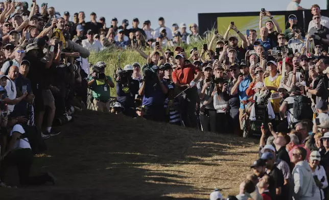 Rory McIlroy of Northern Ireland plays from the rough on the 17th hole during the third round of the British Open golf championship at the Royal Portrush Golf Club, Northern Ireland, Saturday, July 19, 2025. (AP Photo/Peter Morrison)