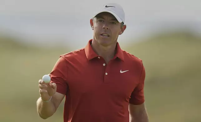 Rory McIlroy of Northern Ireland acknowledges the crowd the crowd on the 16th green during the third round of the British Open golf championship at the Royal Portrush Golf Club, Northern Ireland, Saturday, July 19, 2025. (AP Photo/Francisco Seco)