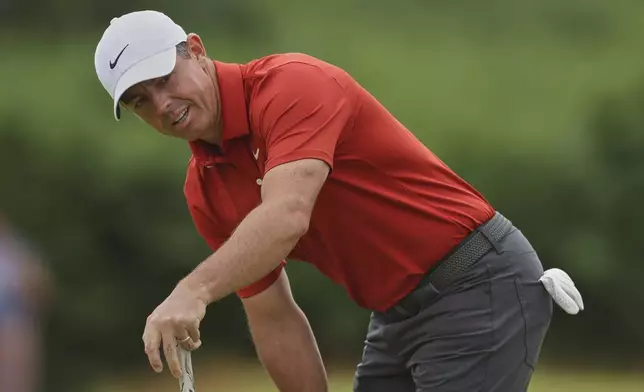 Rory McIlroy of Northern Ireland reacts on the 2nd green after putting during the third round of the British Open golf championship at the Royal Portrush Golf Club, Northern Ireland, Saturday, July 19, 2025. (AP Photo/Peter Morrison)